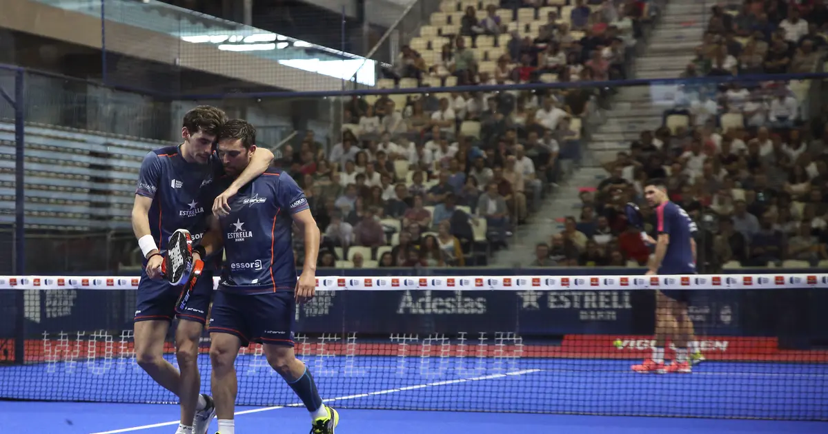A padel player losing the point after the ball strikes their body during a rally