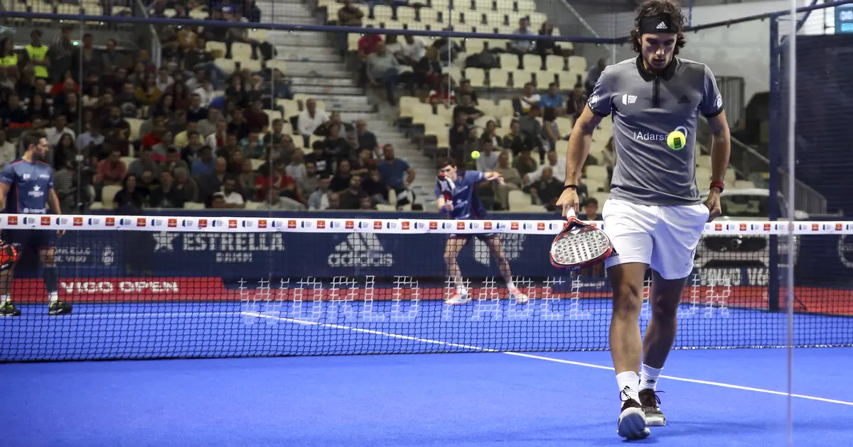 A padel player executing an overhead smash — shoulder strength and mobility are essential for this shot